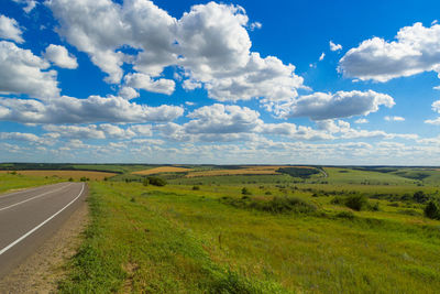 Scenic view of landscape against cloudy sky