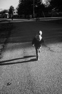 Boy playing with umbrella