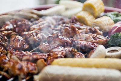 Close-up of meat on barbecue grill