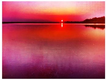 Scenic view of sea at sunset