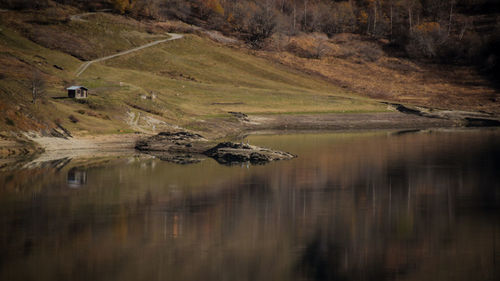 Scenic view of lake with mountains in background