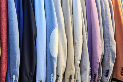 Close-up of clothes hanging in store for sale