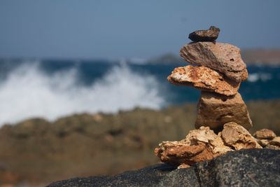 Close-up of rock against sky