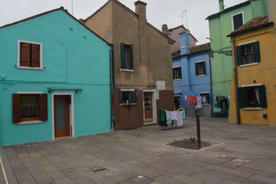 Houses by street in city