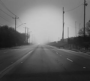 Empty road against sky