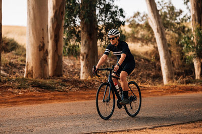 Man riding bicycle on road