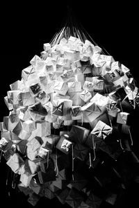 Low angle view of paper decoration against black background