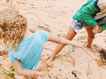 Mother and daughter enjoying at beach