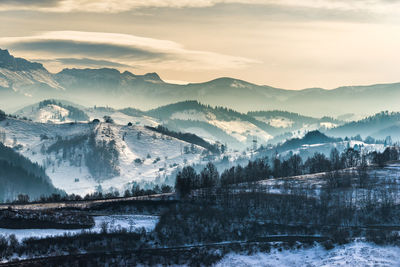 Scenic view of snowcapped mountains against sky