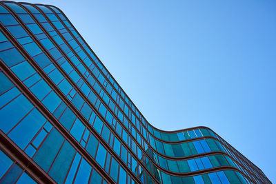 Low angle view of skyscraper against clear sky
