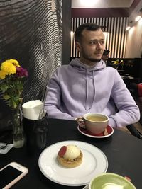 High angle view of man with food on table