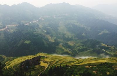 Scenic view of agricultural field and mountains