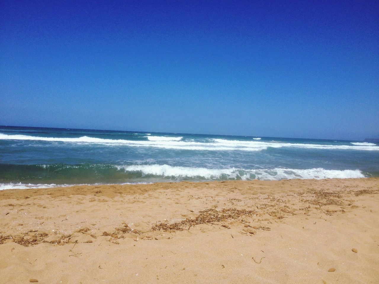 sea, water, beach, blue, horizon over water, clear sky, copy space, shore, sand, scenics, beauty in nature, tranquil scene, tranquility, nature, surf, idyllic, wave, coastline, sky, day