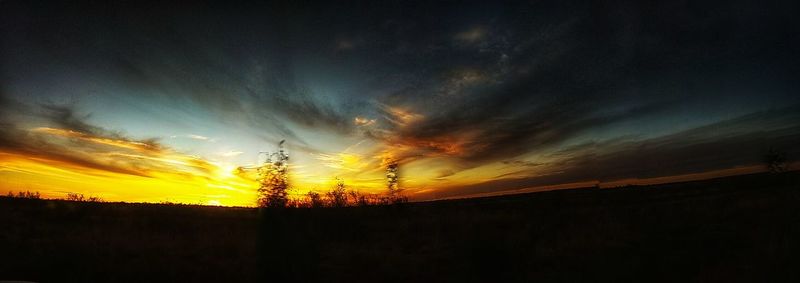 Scenic view of silhouette landscape against sky during sunset