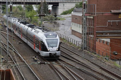 High angle view of train on railroad tracks in city