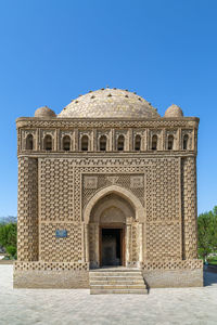 Low angle view of historical building against clear blue sky