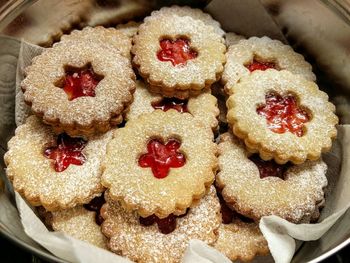 High angle view of jam cookies in container