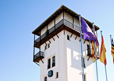 Low angle view of building against clear blue sky