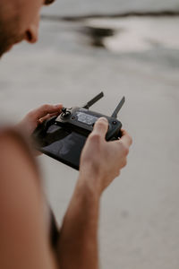 Close-up of man using mobile phone