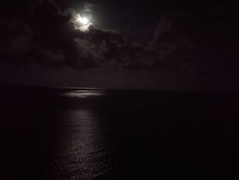 Scenic view of sea against sky at night