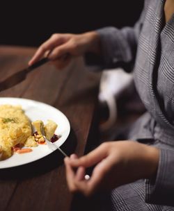 Midsection of woman having food