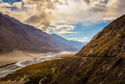 Scenic view of mountains against dramatic sky