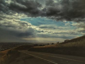 Scenic view of landscape against cloudy sky