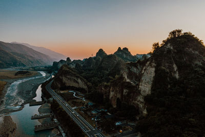 High angle view of bridge over river against sky during sunset