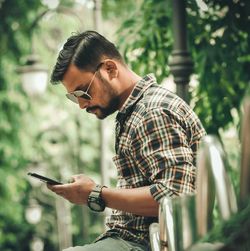 Young man using mobile phone