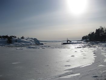 Scenic view of sea against sky during sunny day