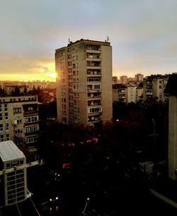 High angle view of buildings against sky during sunset