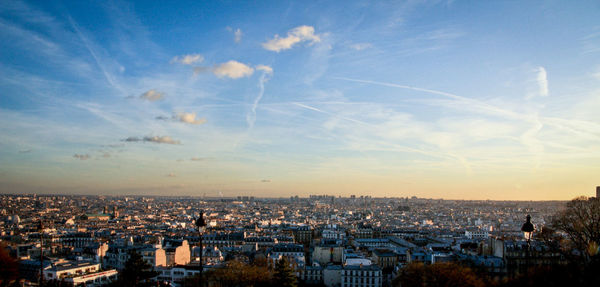 Aerial view of cityscape against sky