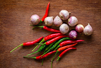 Close-up of red chili peppers on table