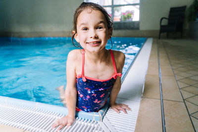 Portrait of smiling girl in swimming pool