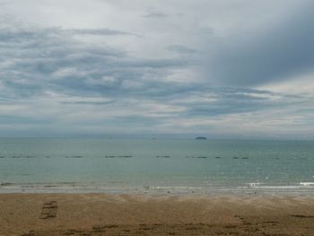 Scenic view of calm sea against sky