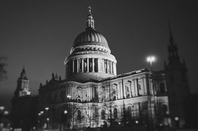 Low angle view of st paul cathedral against sky in city at night