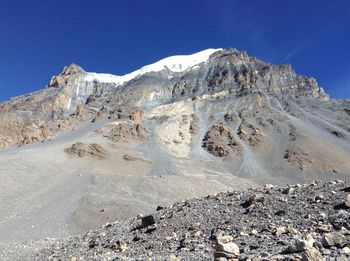 Scenic view of rocky mountains against clear blue sky