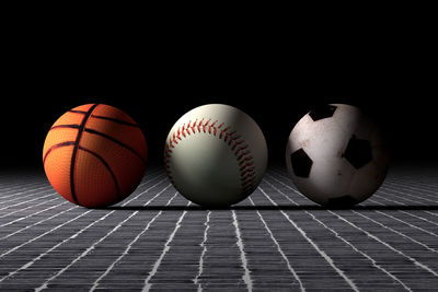 Sport balls against black background