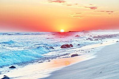 Scenic view of sea against sky during sunset