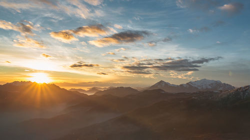 Scenic view of mountains against sky during sunset