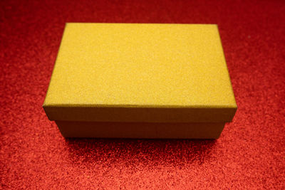 High angle view of yellow paper on table