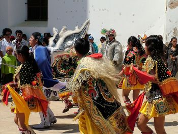 Group of people in traditional clothing during festival