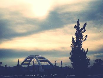 Road against cloudy sky at sunset