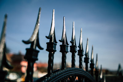 Close-up of machinery against sky