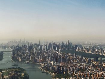 High angle view of buildings in city against sky