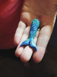 Close-up of man holding hand