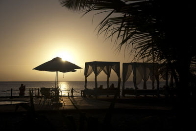 Scenic view of beach against sky during sunset