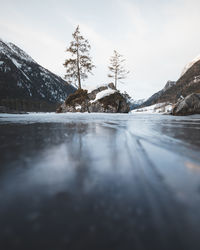 Surface level of frozen lake by mountains