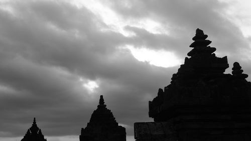 Low angle view of statue against cloudy sky