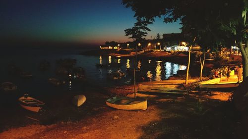 View of bridge over sea at night